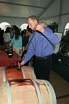 Gregg Cove pouring the wine<br>at the 4th Annual Peconic Bay Winery Thanksgiving Barrel Tasting and auction to benefit the Wildllife Trust and the NYIT Culinary Arts Center at Peconic Bay vineyards in Cutchogue, N.Y. on 11-20-05. photo by Rob Rich copyright 2005 516-676-3939 robwayne1@aol.com,